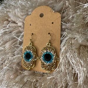 Powerful Hand Gold tone Earrings in Black, blue and gold tone with fish hook